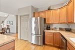 Kitchen with gas range/oven, breakfast bar with seating for two 